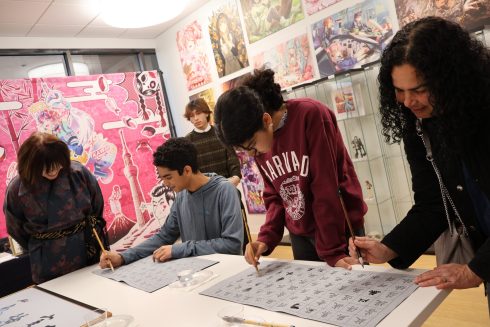 Attendees enjoy shodo (Japanese calligraphy)